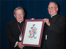 Bishop Blaire presents Bishop Morin with the CCHD Sister Margaret Cafferty Development of People Award in recognition of his dedicated service to the poor.