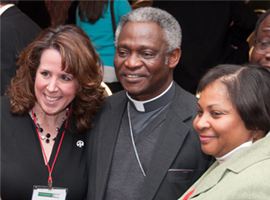 Cardinal Turkson stops to meet CSMG attendees after the 2011 opening plenary.