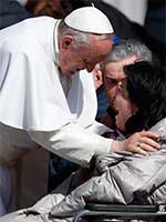 Pope Francis greets a disabled woman overcome with emotion during a March 2015 general audience. CNS Photo/Paul Haring