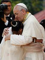 Pope Francis embraces a teen during his January 2015 visit to the Philippines. CNS Photo/Paul Haring