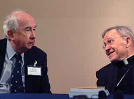 Cardinal Kasper speakes to Rev. Wainwright during an ecumenical meeting