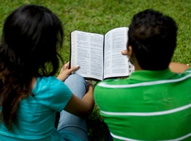 A couple reads the bible.