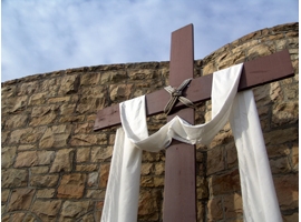 A cross draped in white is symbolic of the Easter season. iStock image.