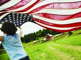 girl runs by barn with American flag montage