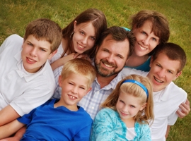 Family of five children and their parents. 