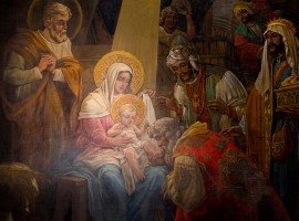 The adoration of the Magi is depicted in a painting in the Cathedral Basilica of Sts. Peter and Paul in Philadelphia. CNS photo/Nancy Phelan Wiechec