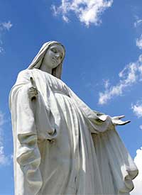 A statue of Mary overlooks the grounds of St. Jude Church in Mastic Beach, N.Y. CNS Photo/Gregory A. Shemitz