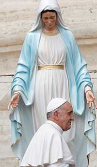Pope Francis walks near a statue of Mary during his general audience in St. Peter's Square at the Vatican in this May 29, 2013. CNS Photo/Paul Haring