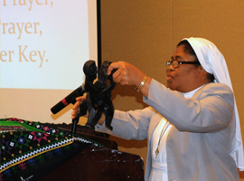Sr. Joanna Okereke displays the SKU (Unity Symbol)