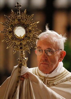 Pope Francis leads Benediction outside the Basilica of St. Mary Major at the conclusion of the Corpus Christi procession in Rome May 30. (CNS photo/Paul Haring)