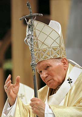Pope John Paul II waves to the crowd following Mass at the TWA Dome in St. Louis Jan. 27, 1999. CNS file photo/Nancy Wiechec.