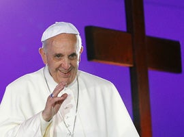 Pope Francis greets the crowd as he arrives for the World Youth Day welcoming ceremony. (CNS photo/Paul Haring)