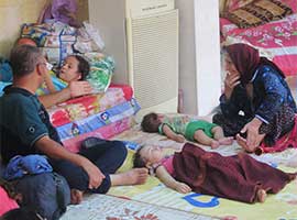 Iraqi Christian refugees forced from their homes by Muslim extremists rest at St Joseph's Church in Ankawa, Iraq, in August 2014. CNS photo/Sahar Mansour