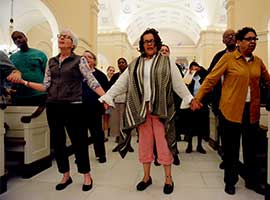 People join hands during an April 25, 2016, interfaith prayer service for peace at the Basilica of the National Shrine of the Assumption of the Blessed Virgin Mary in Baltimore. CNS Photo/Kevin J. Parks