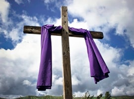 purple-draped-lenten-cross-montage-istock