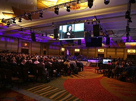 Delegates listen as Los Angeles Auxiliary Bishop Robert E. Barron is projected on a screen July 4 during the "Convocation of Catholic Leaders: The Joy of the Gospel in America" in Orlando, Fla.  (CNS photo/Bob Roller)
