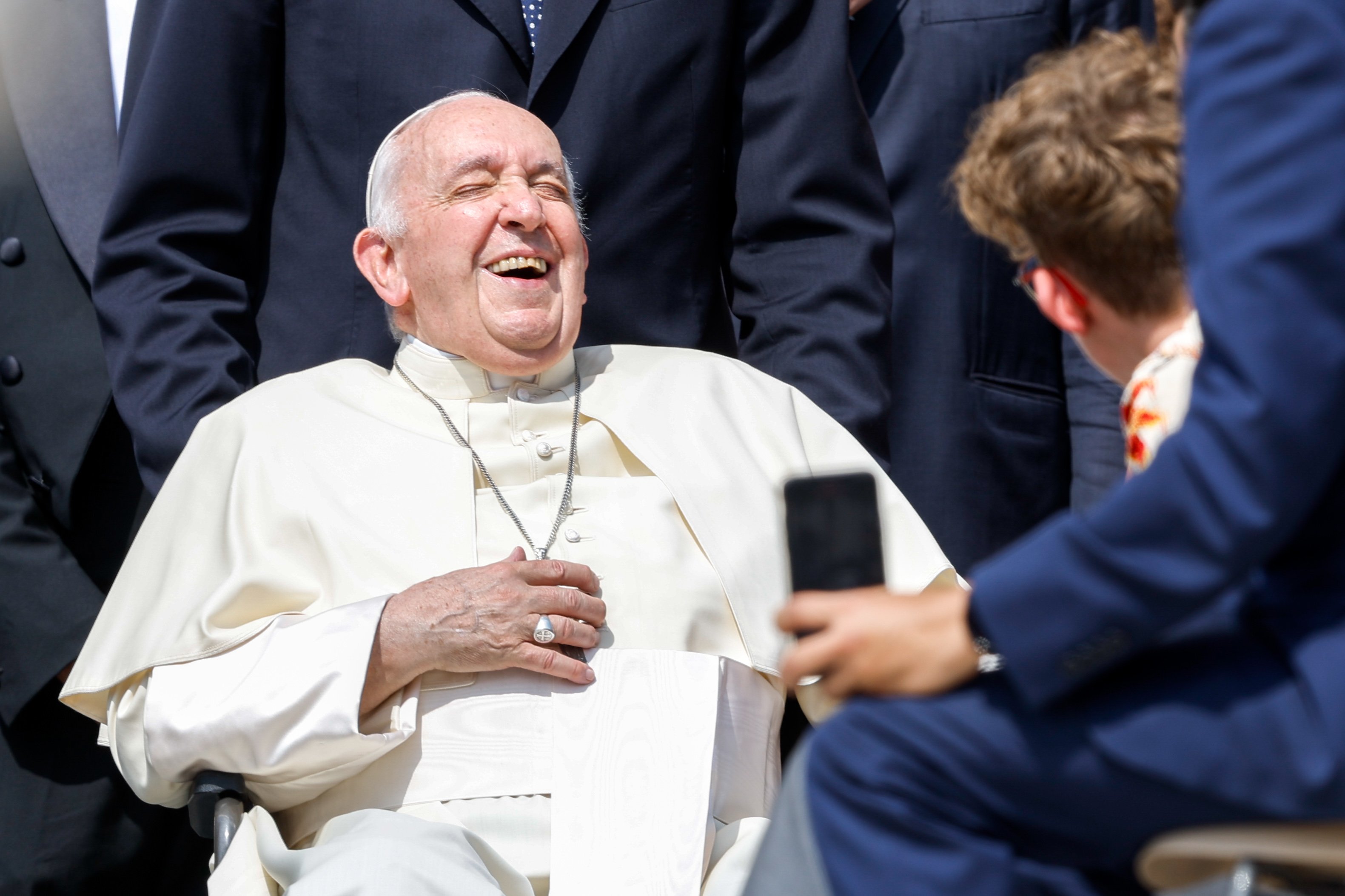 Pope Francis laughs.