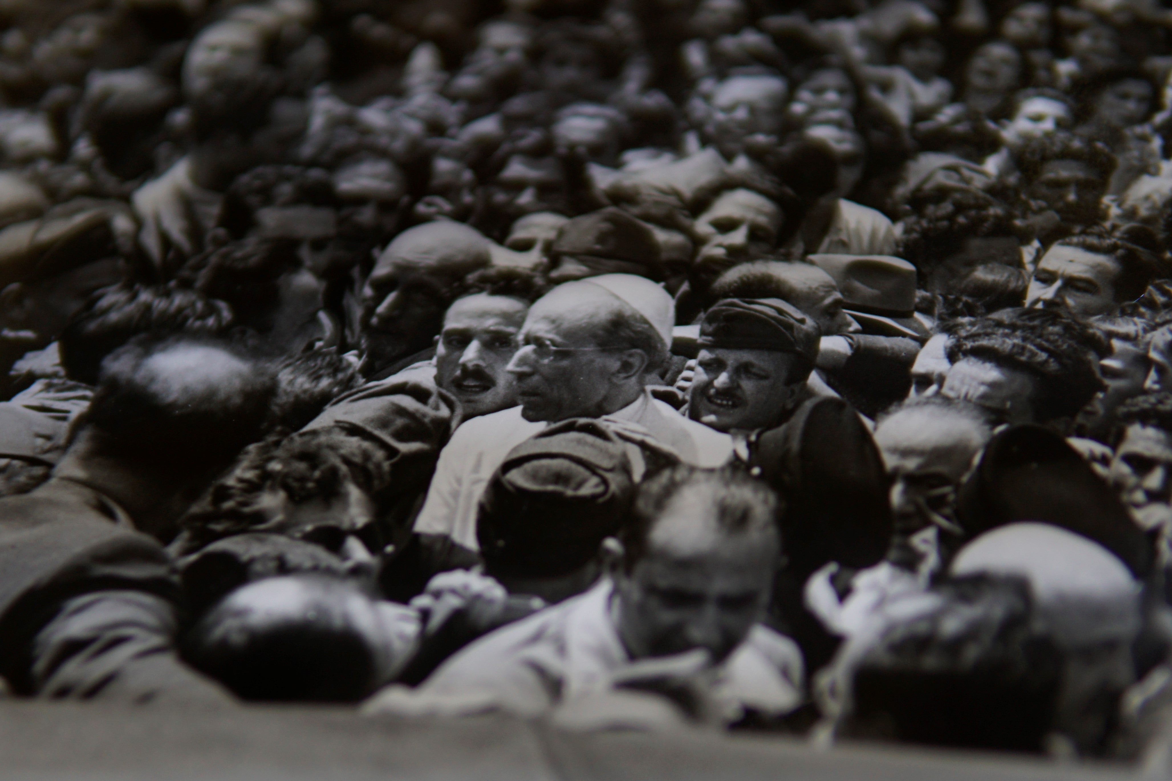 Pope Pius XII in a crowd of people.
