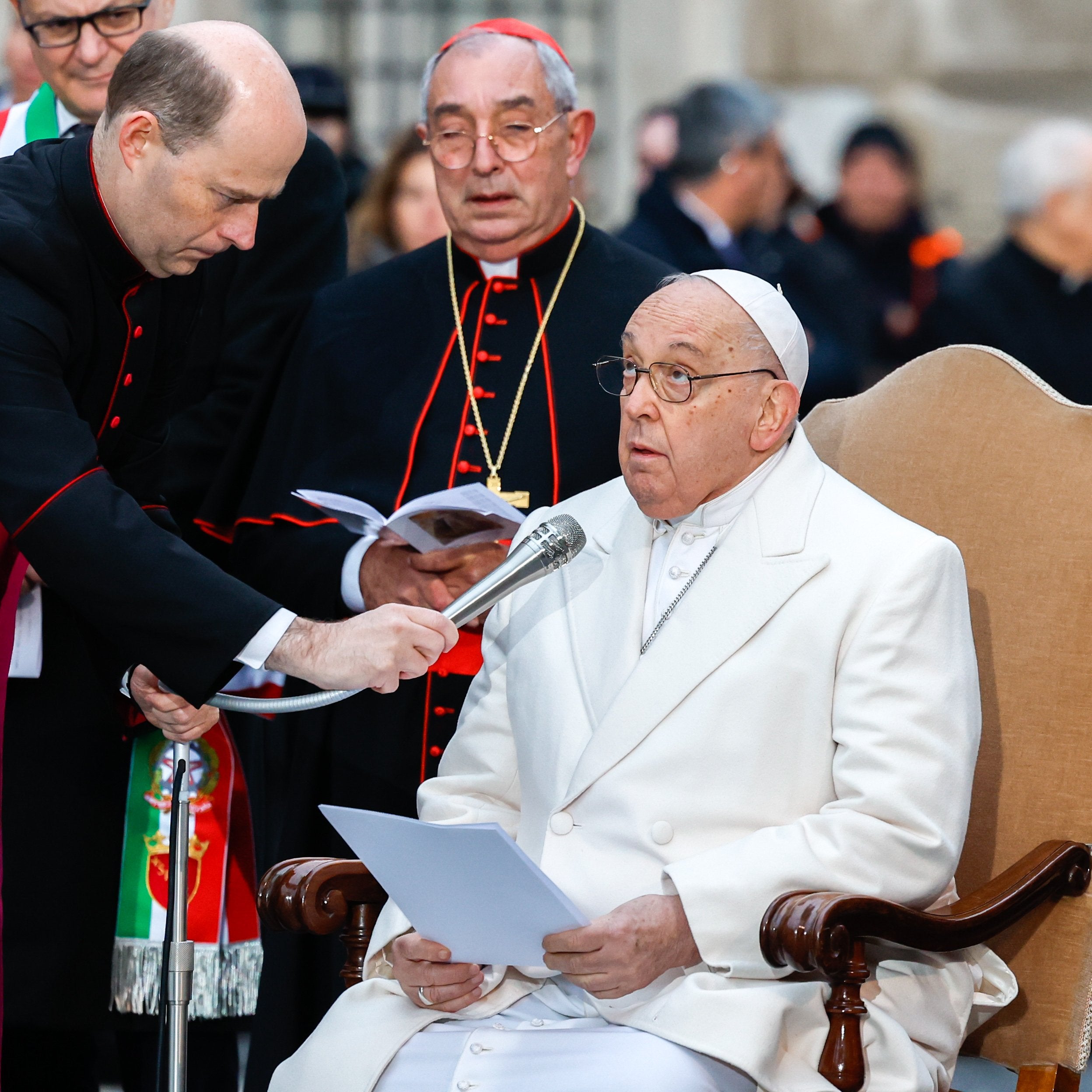 Pope Francis looks at a Marian statue.