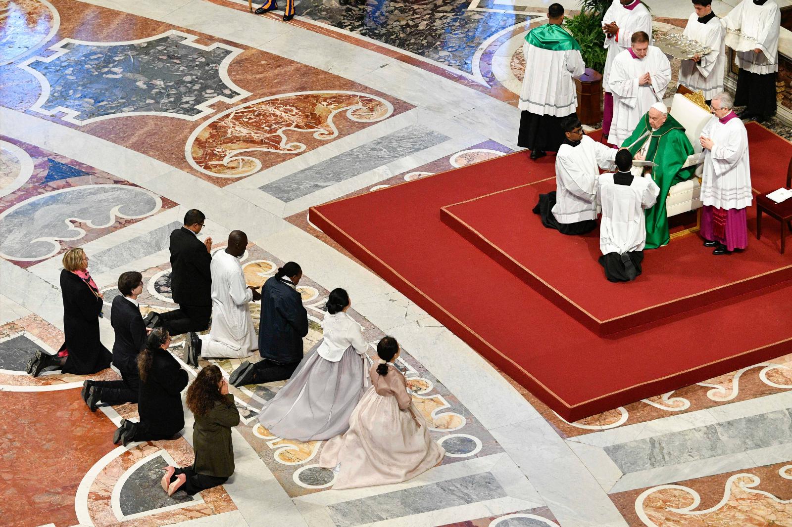 Pope Francis prays for catechists