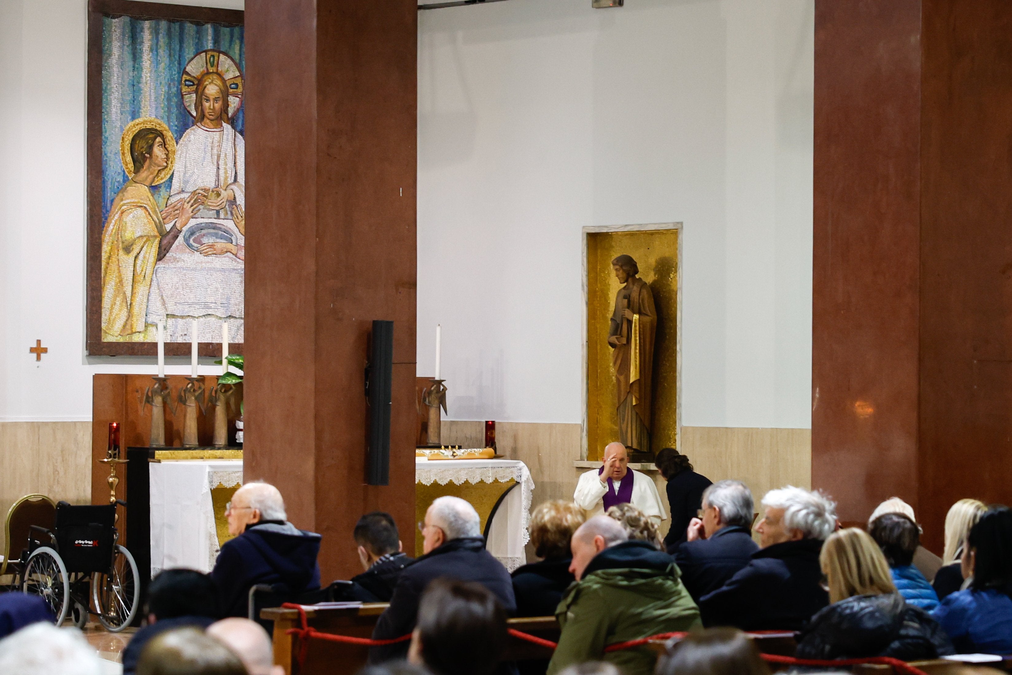 Pope Francis hears a woman's confession.