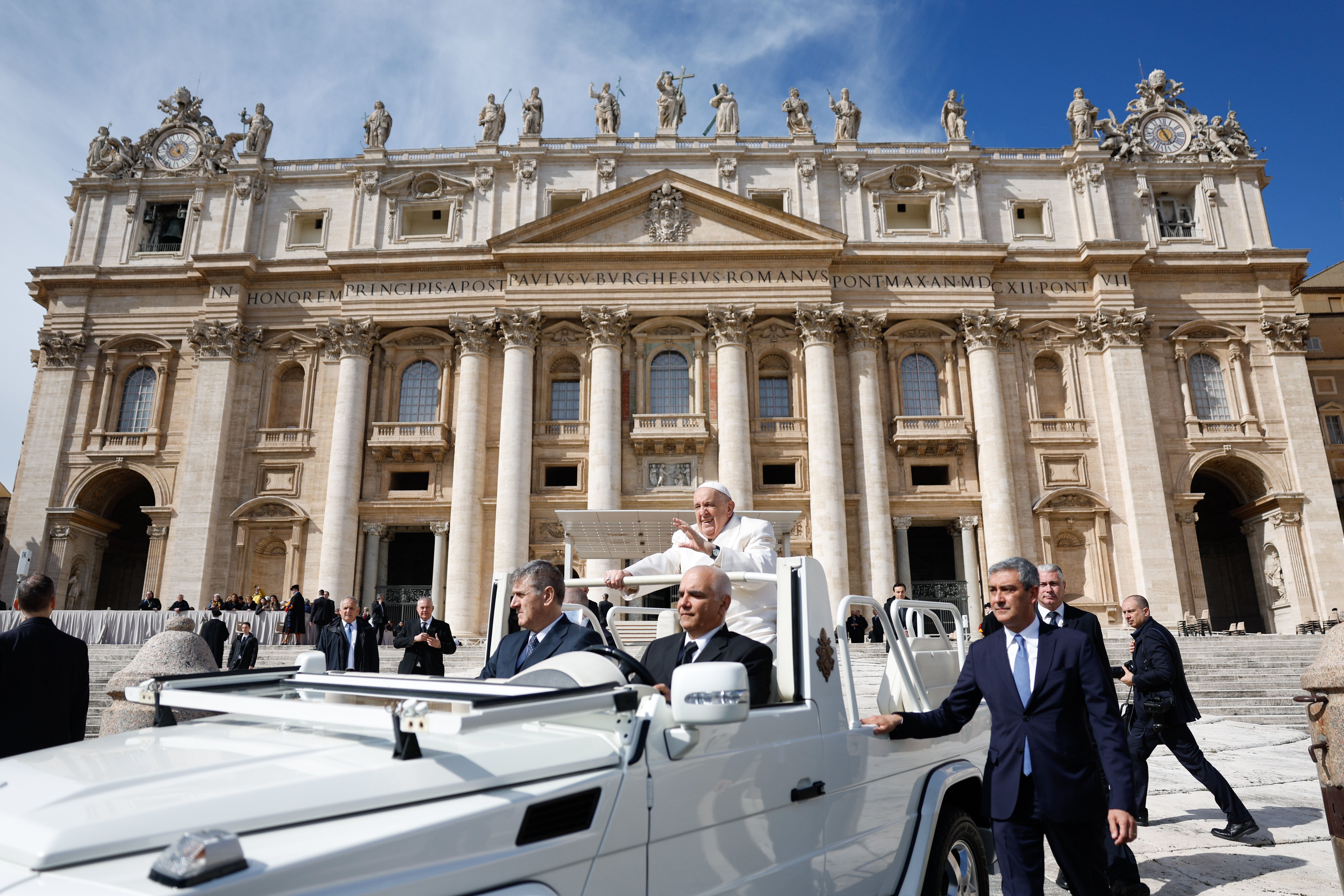 Pope Francis rides the popemobile in St. Peter's Square.