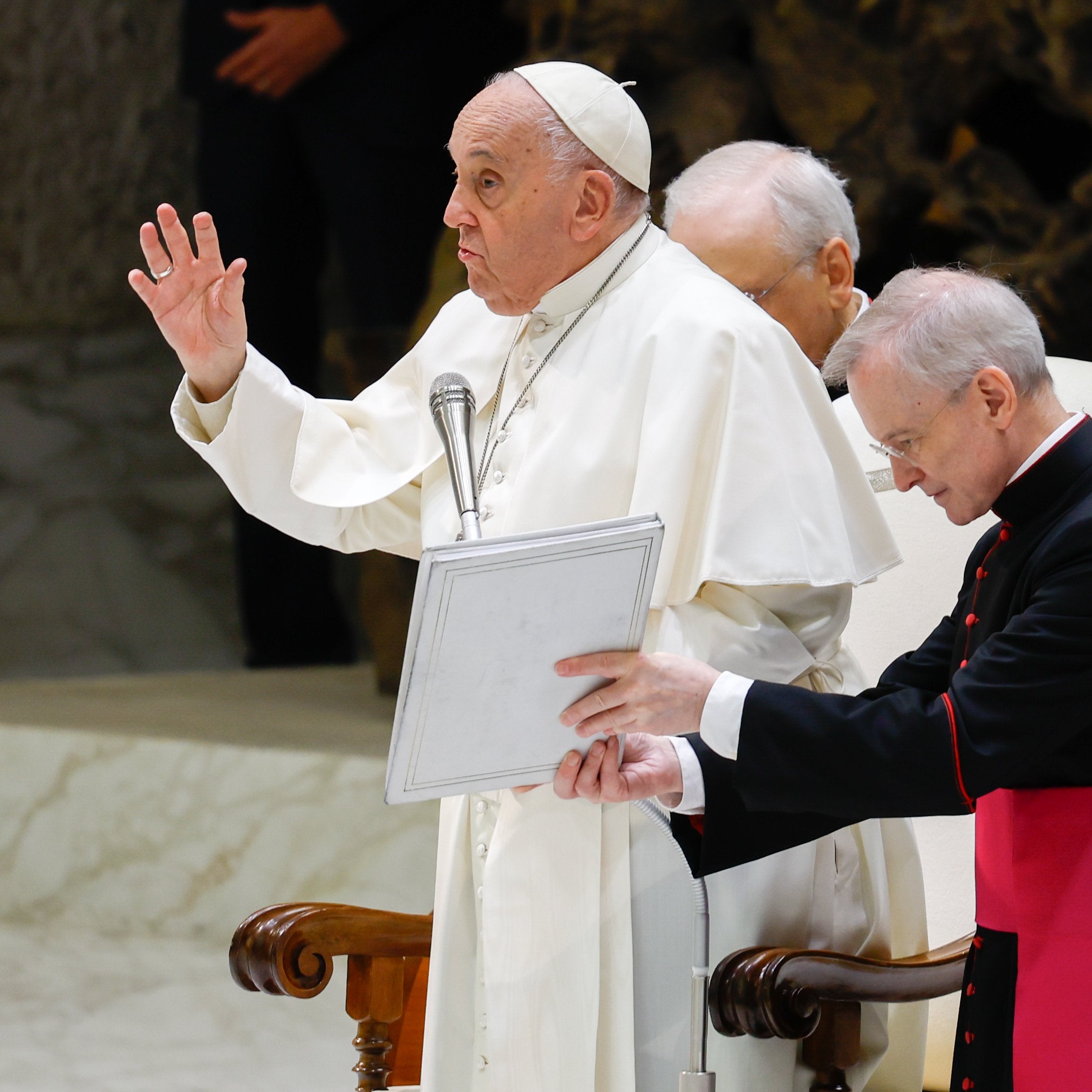 Pope Francis gives a blessing.