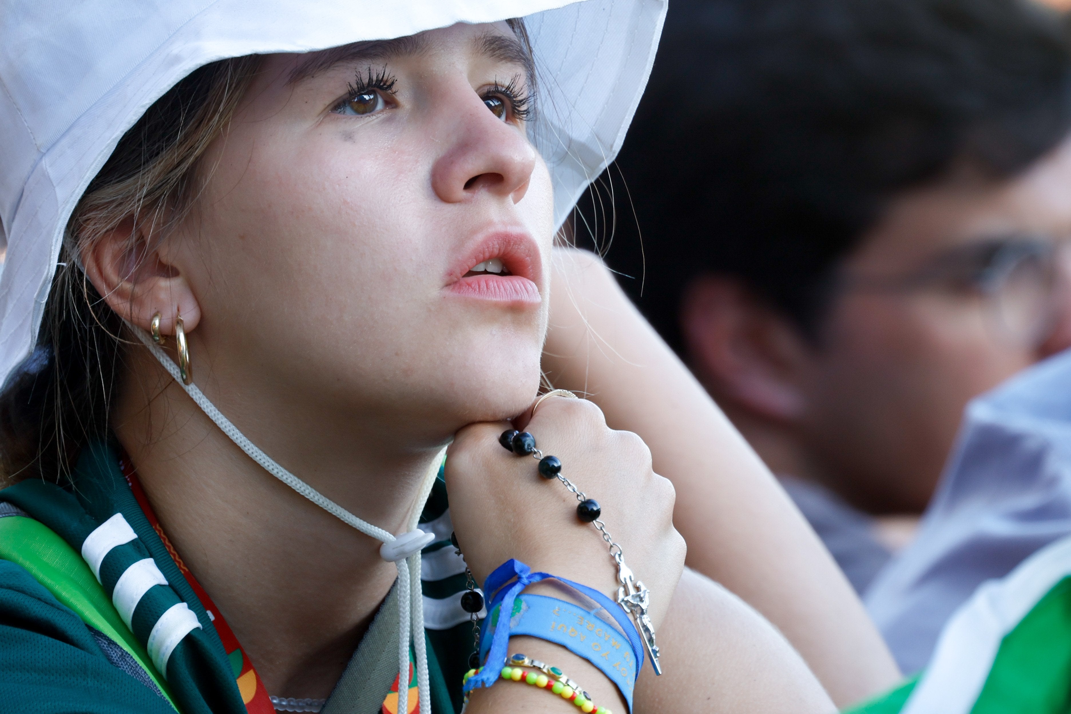 A young person prays the Stations of the Cross.