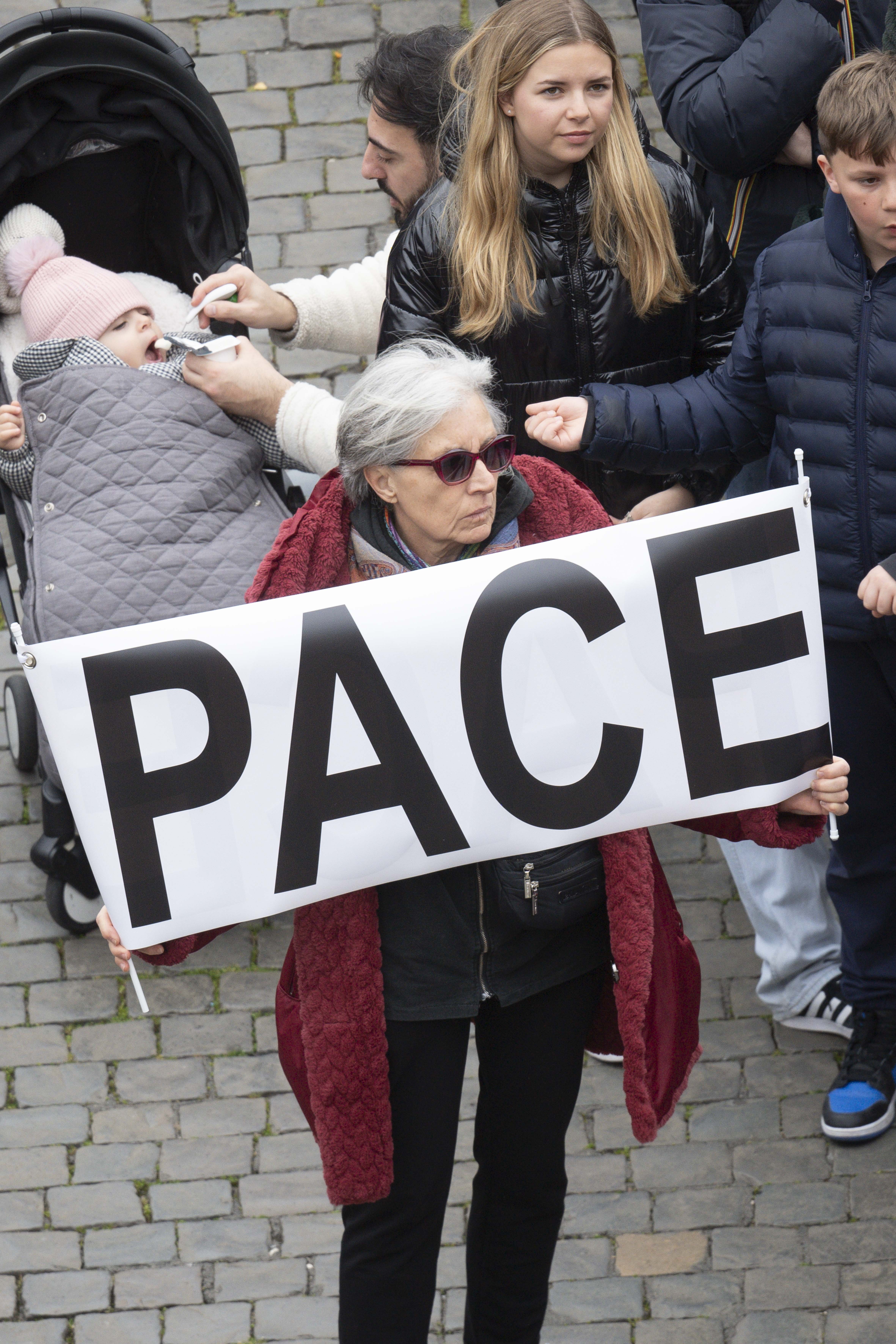 Woman holds peace sign