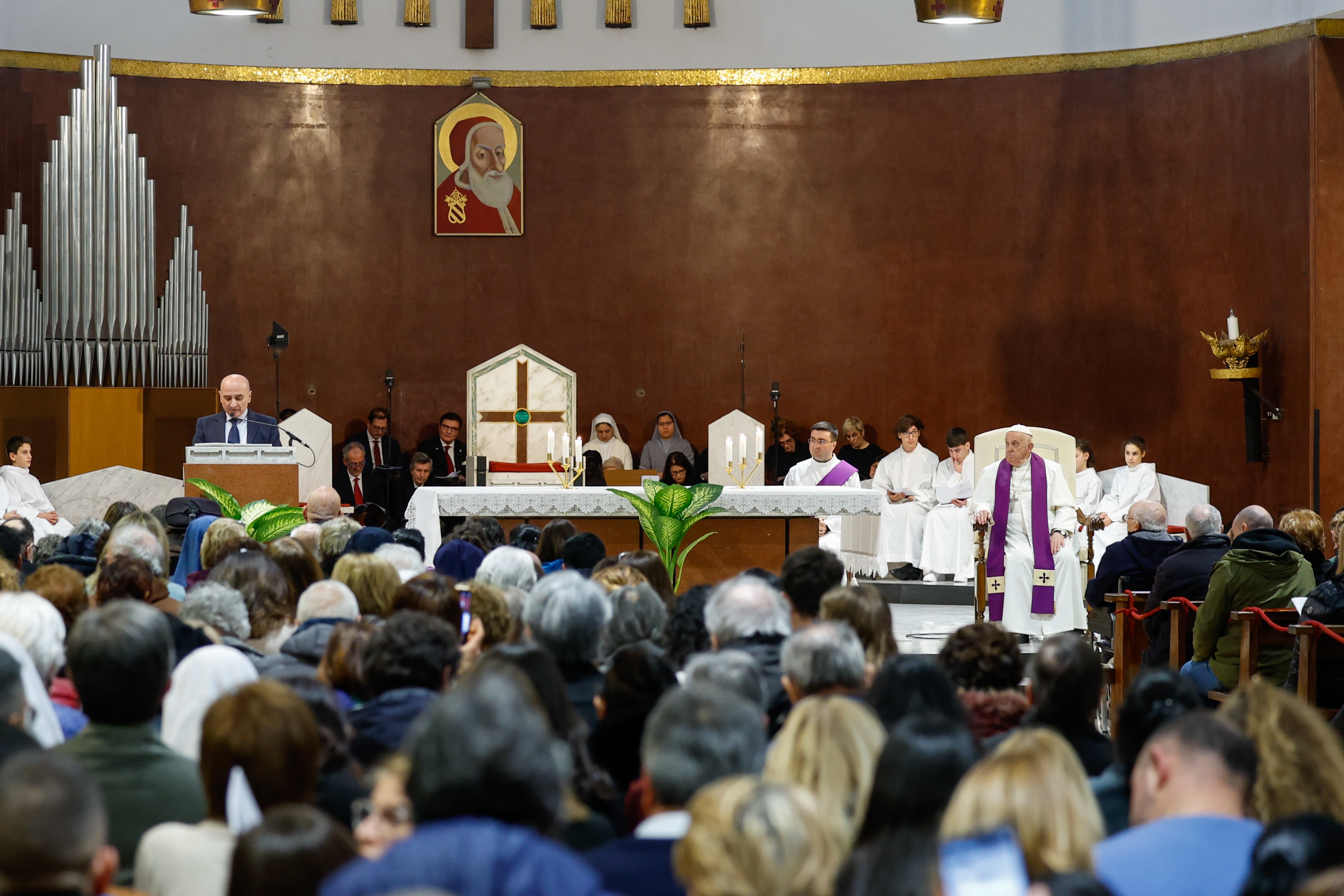 Pope Francis attends a Lenten penance service.
