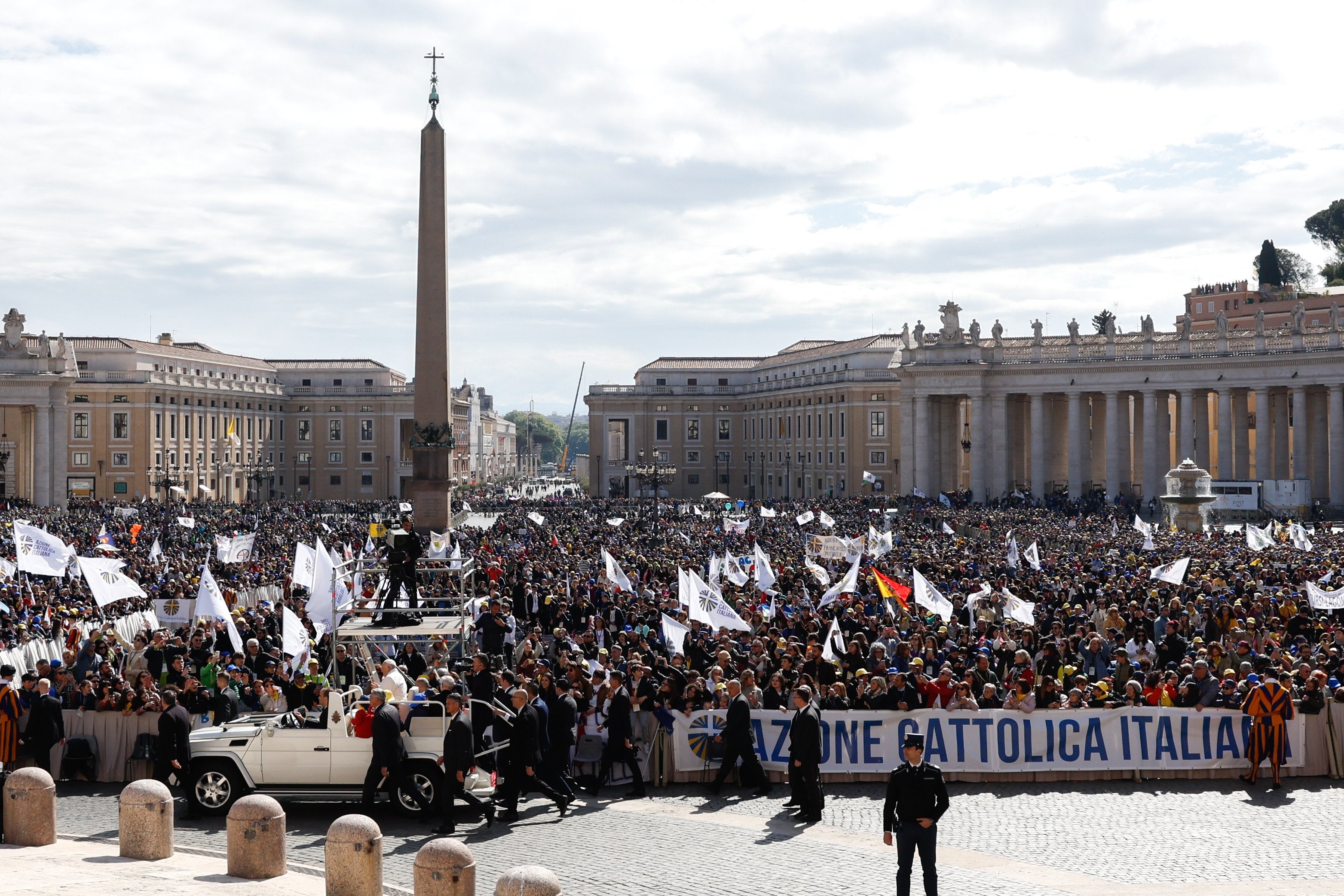 Pope Francis greets people.