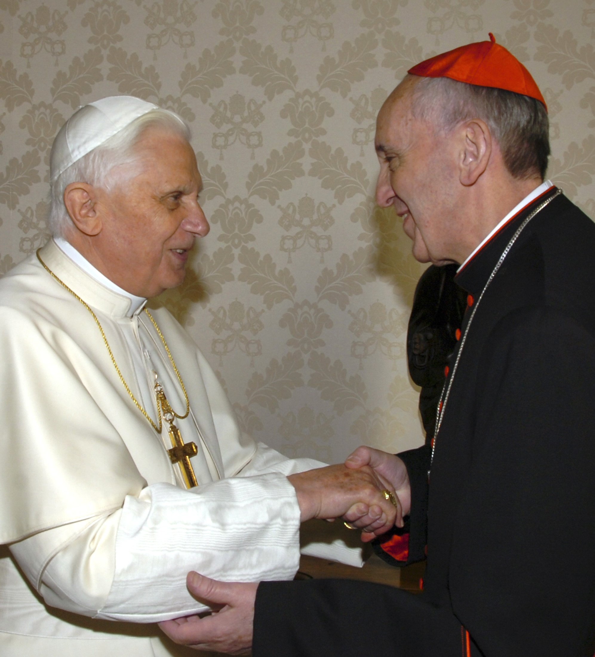 Pope Benedict XVI greets Cardinal Jorge Mario Bergoglio.