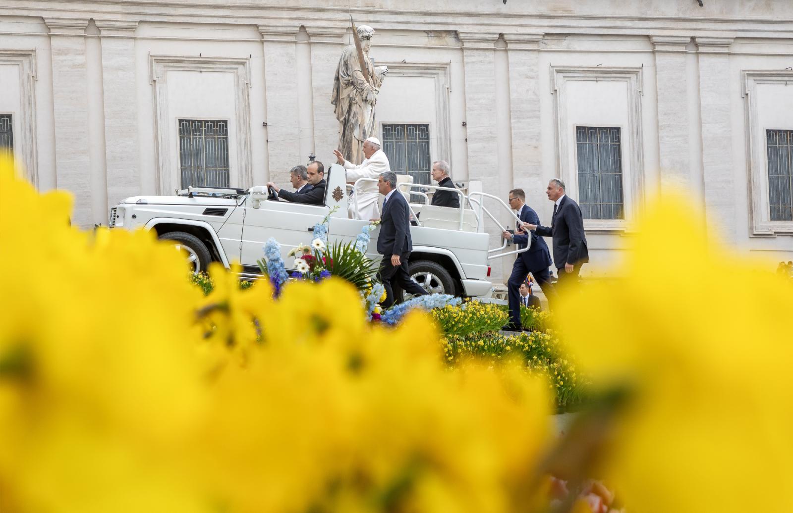 Pope Francis rides in the popemobile