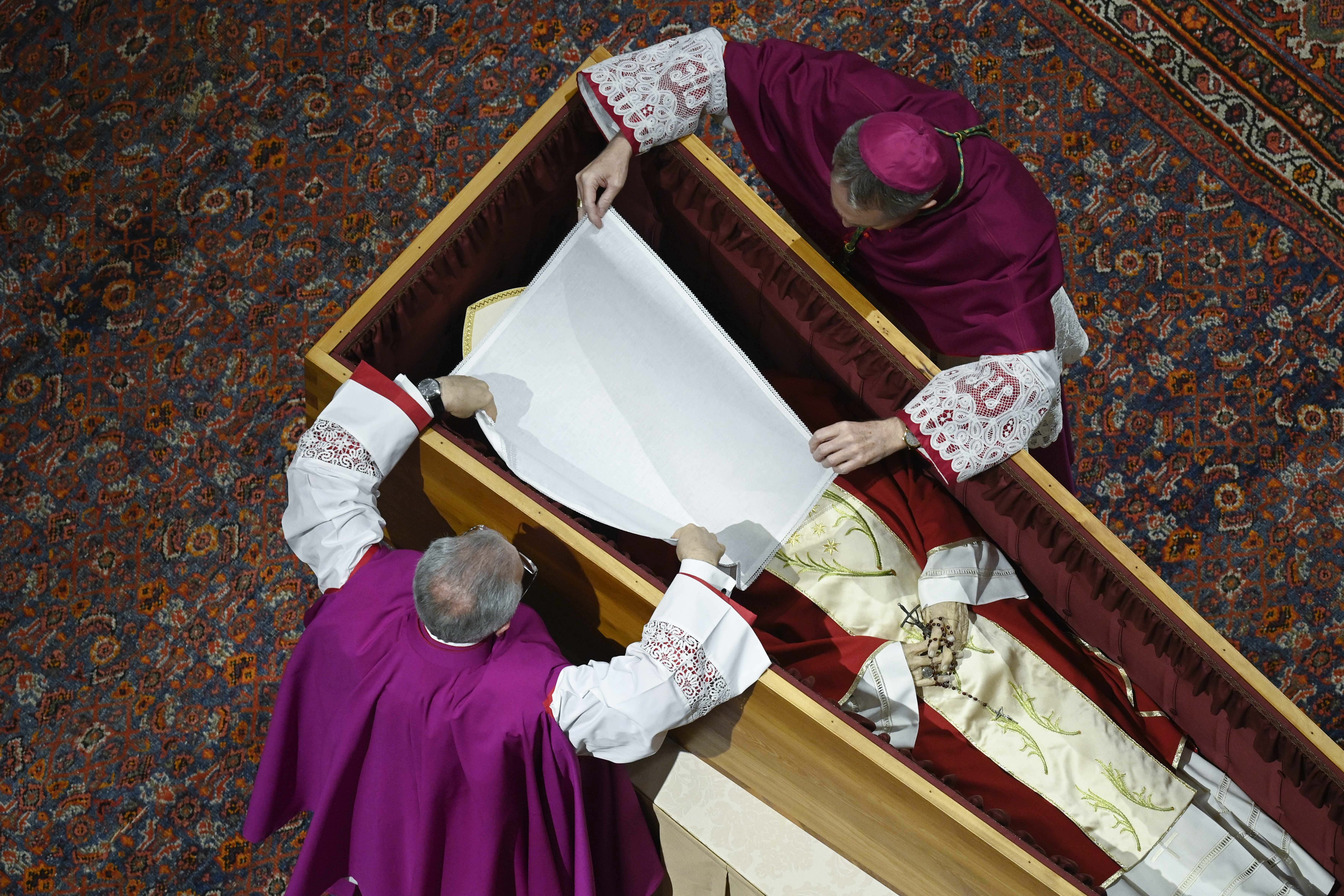 The face of Pope Benedict XVI's body is covered. 