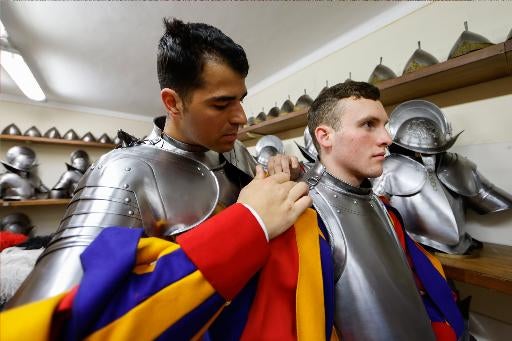 Swiss Guards adjust armor