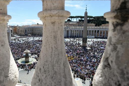 People gather in St. Peter's Square to pray with the pope