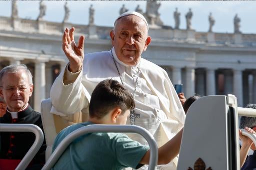 Pope Francis rides in the popemobile