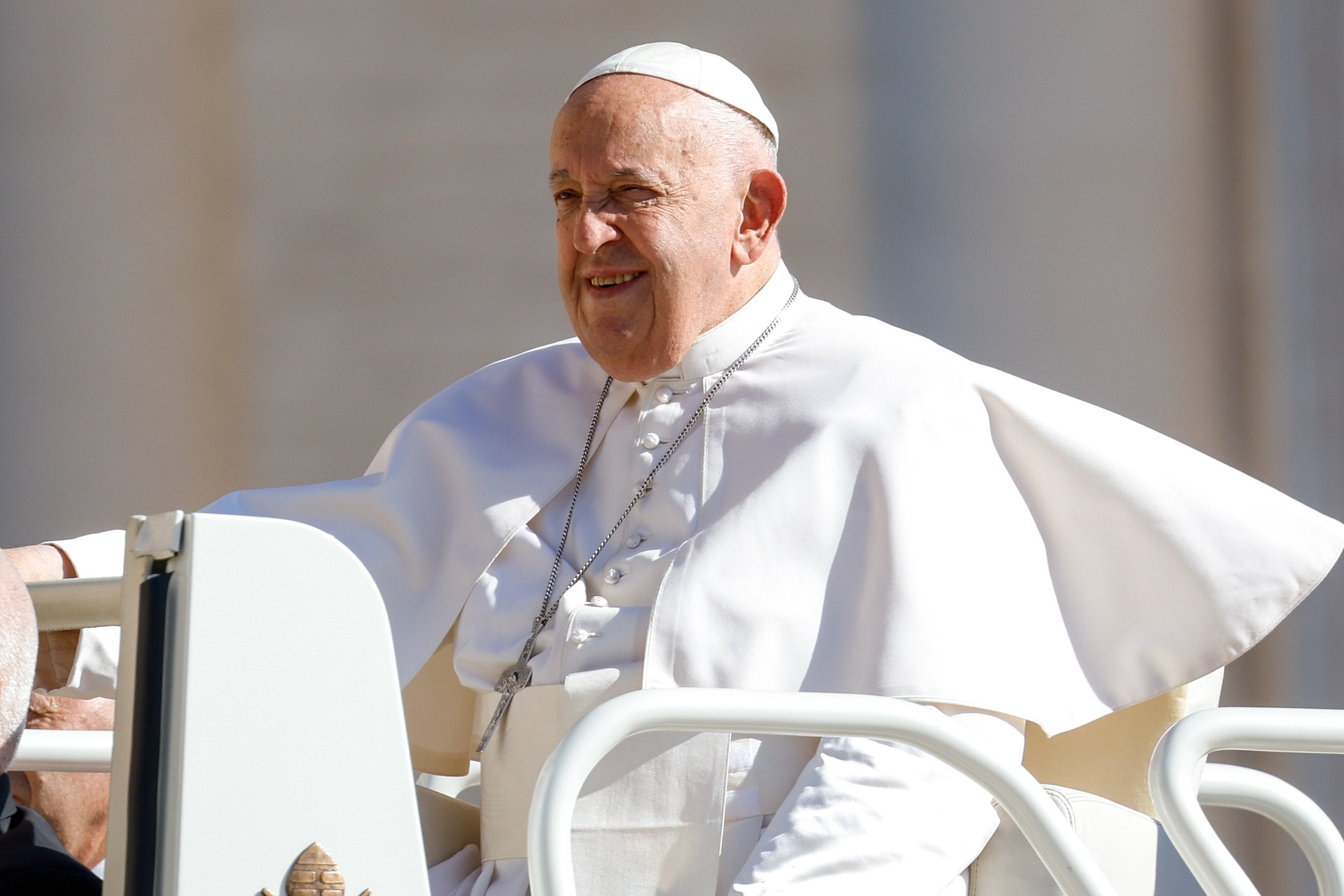 Pope Francis rides the popemobile in St. Peter's Square.