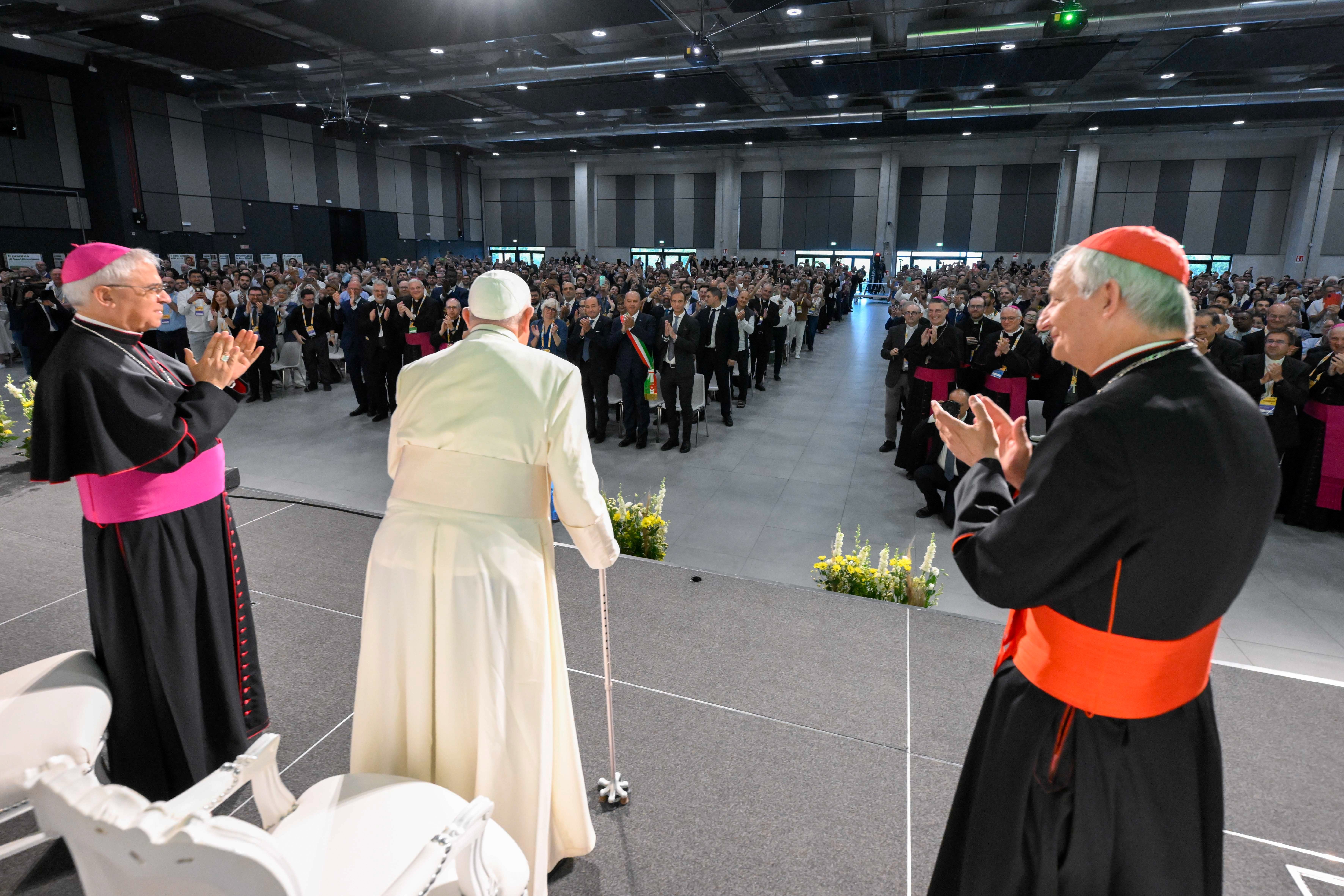 Pope Francis greets attendees.