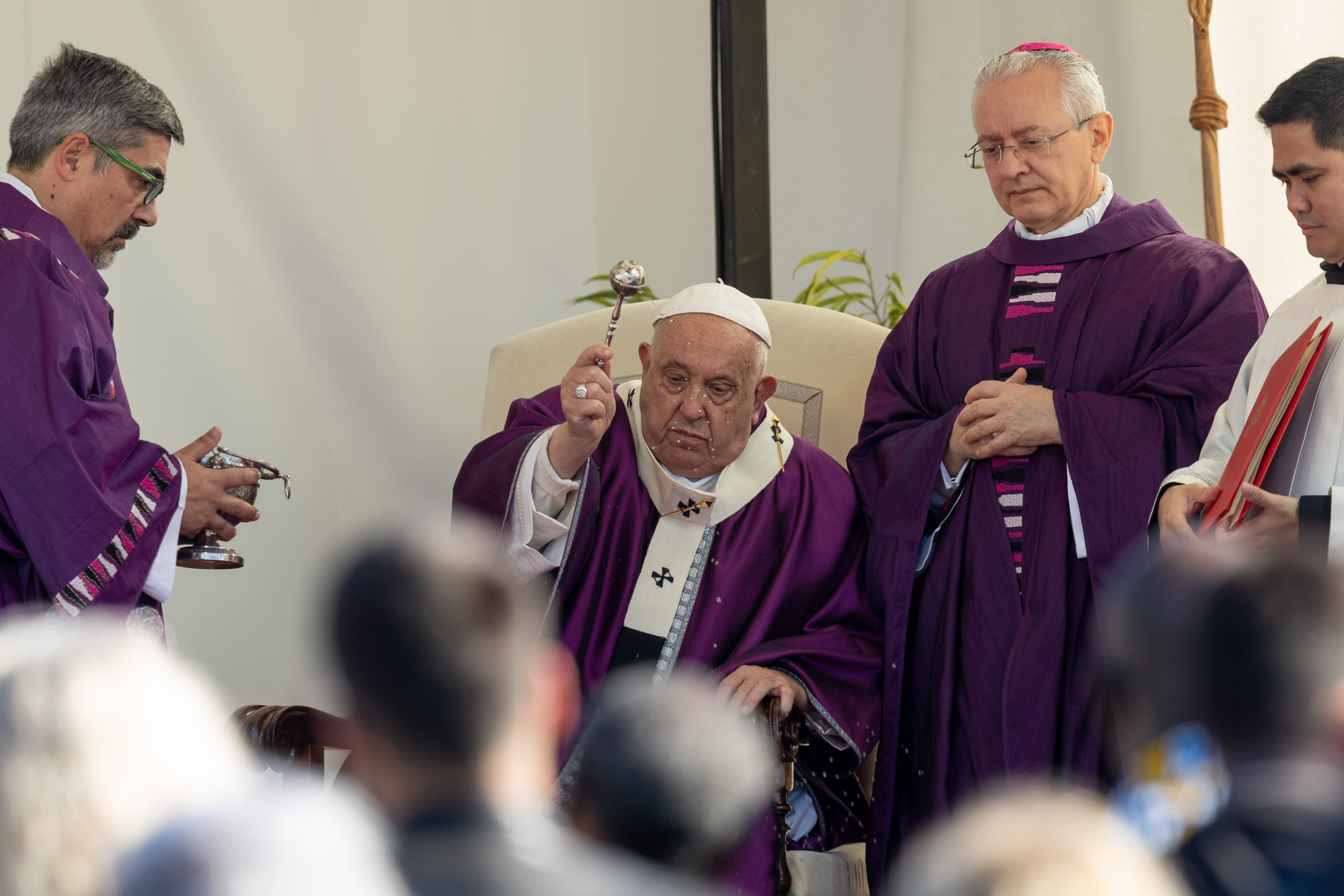 Pope Francis blesses cemetery with holy water