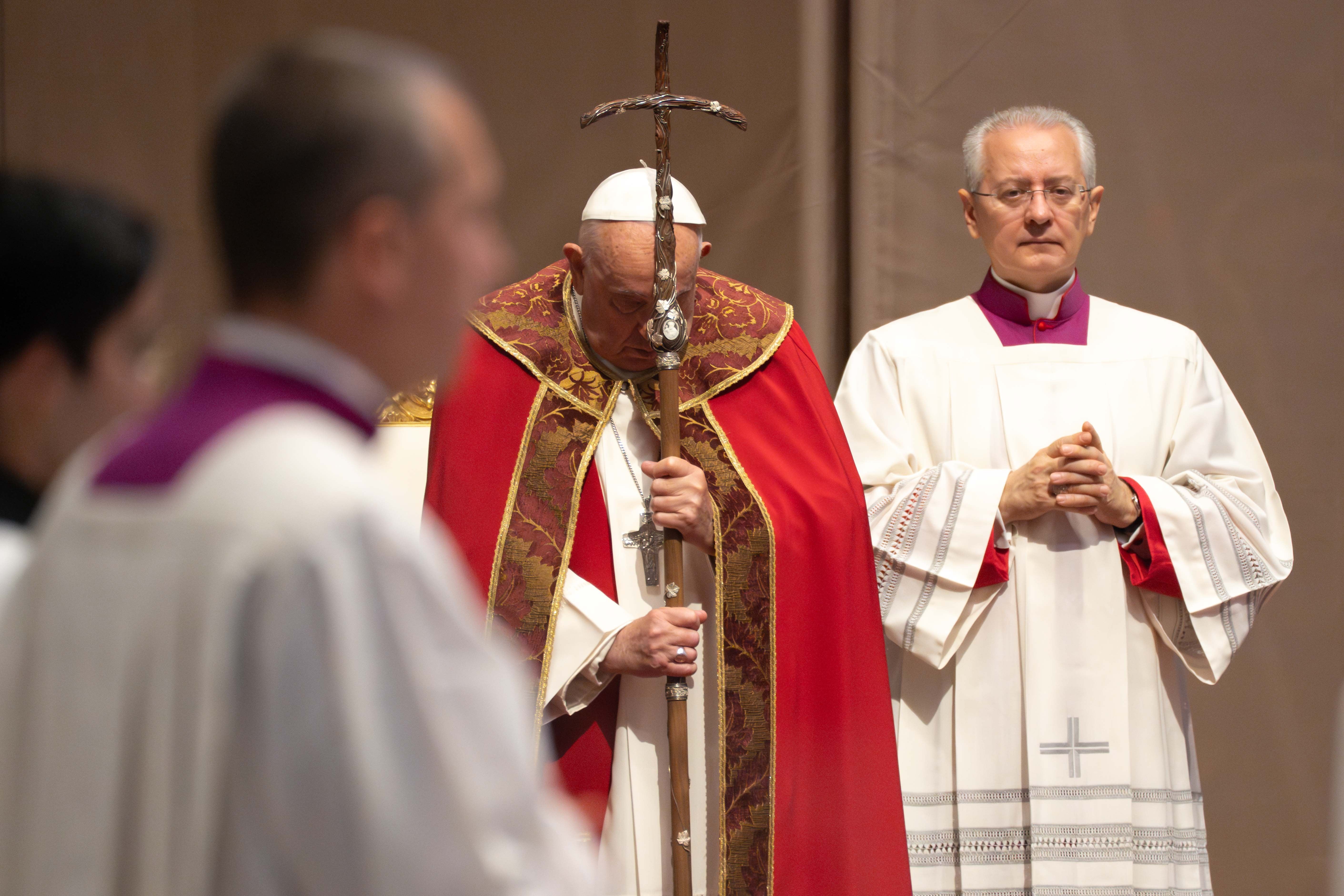Pope Francis prays at Mass