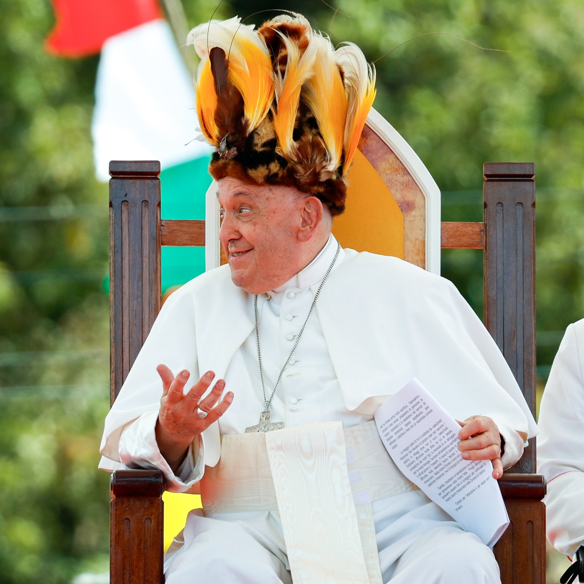 Pope Francis wears a traditional headdress in Papua New Guinea