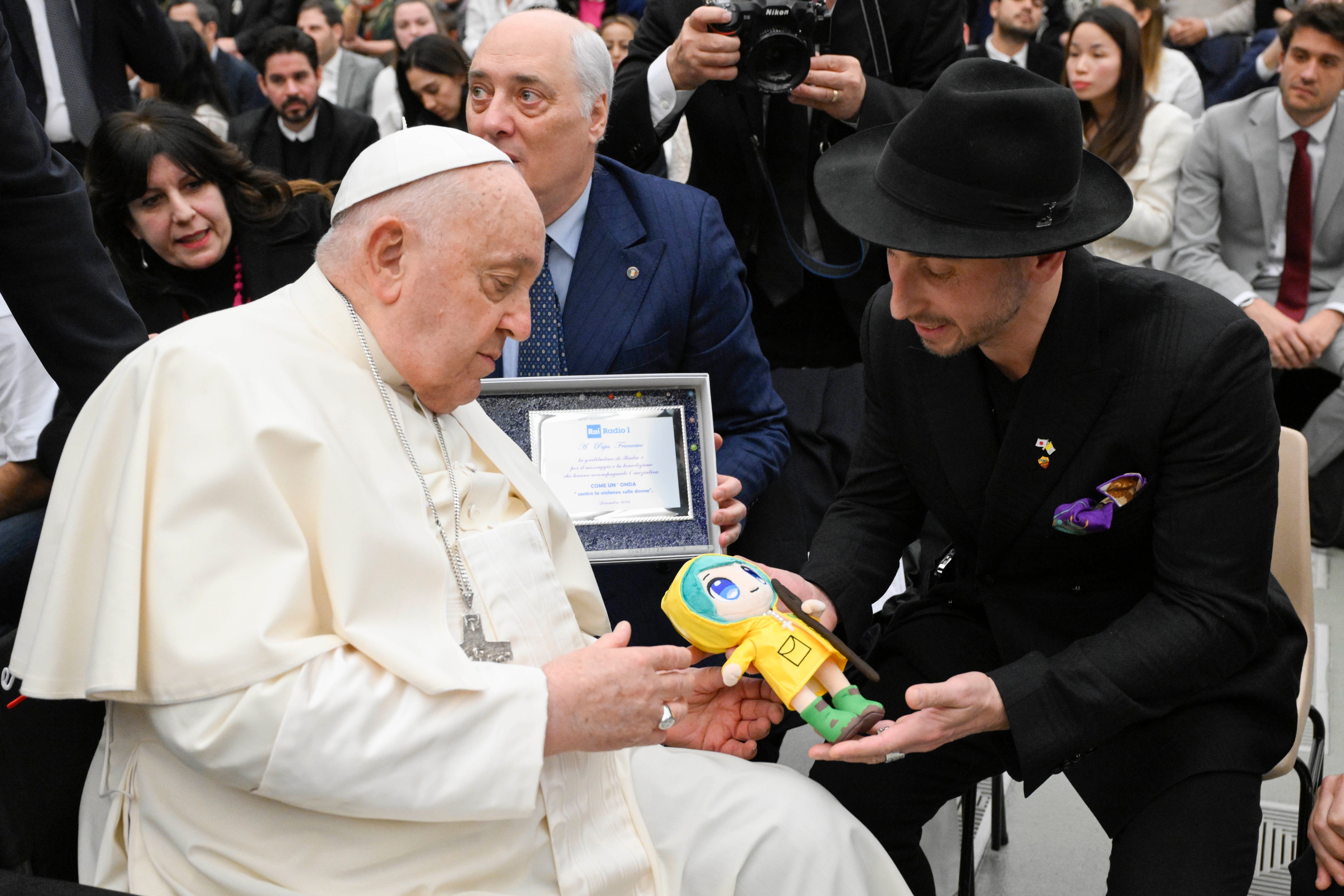 Pope Francis receives a Luce doll.