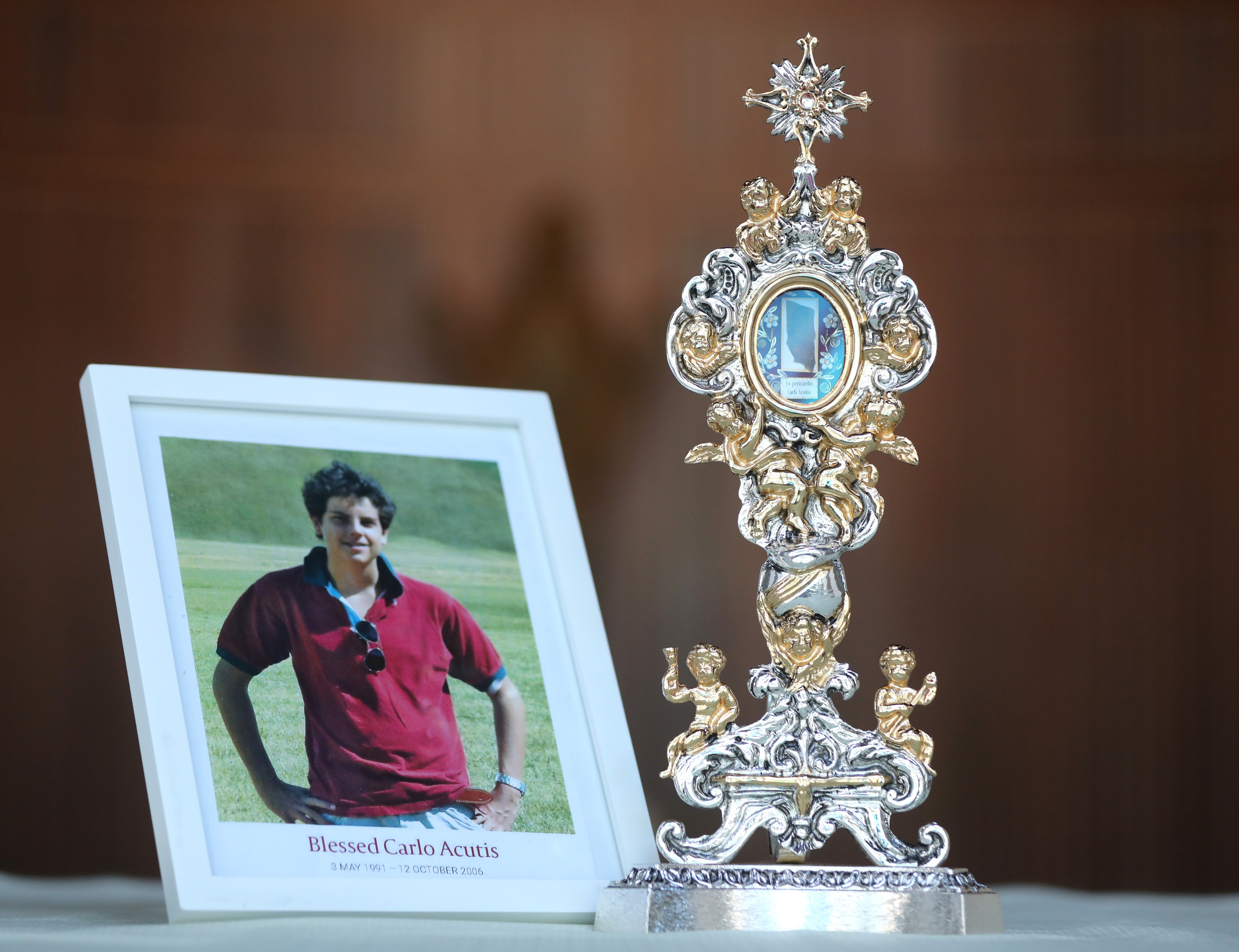 A photo and relic of Blessed Carlo Acutis