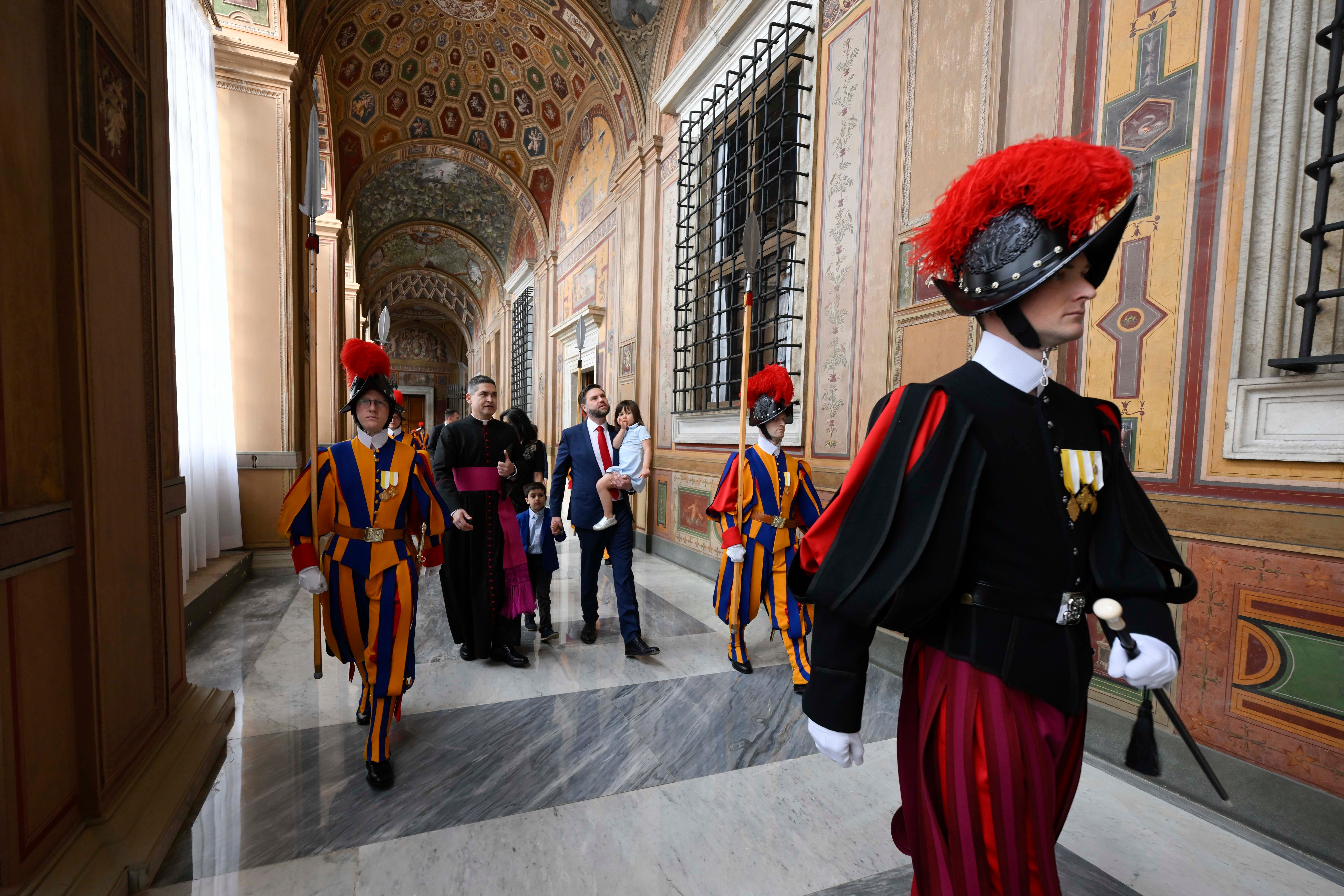 JD Vance and family accompanied by members of the Swiss Guard