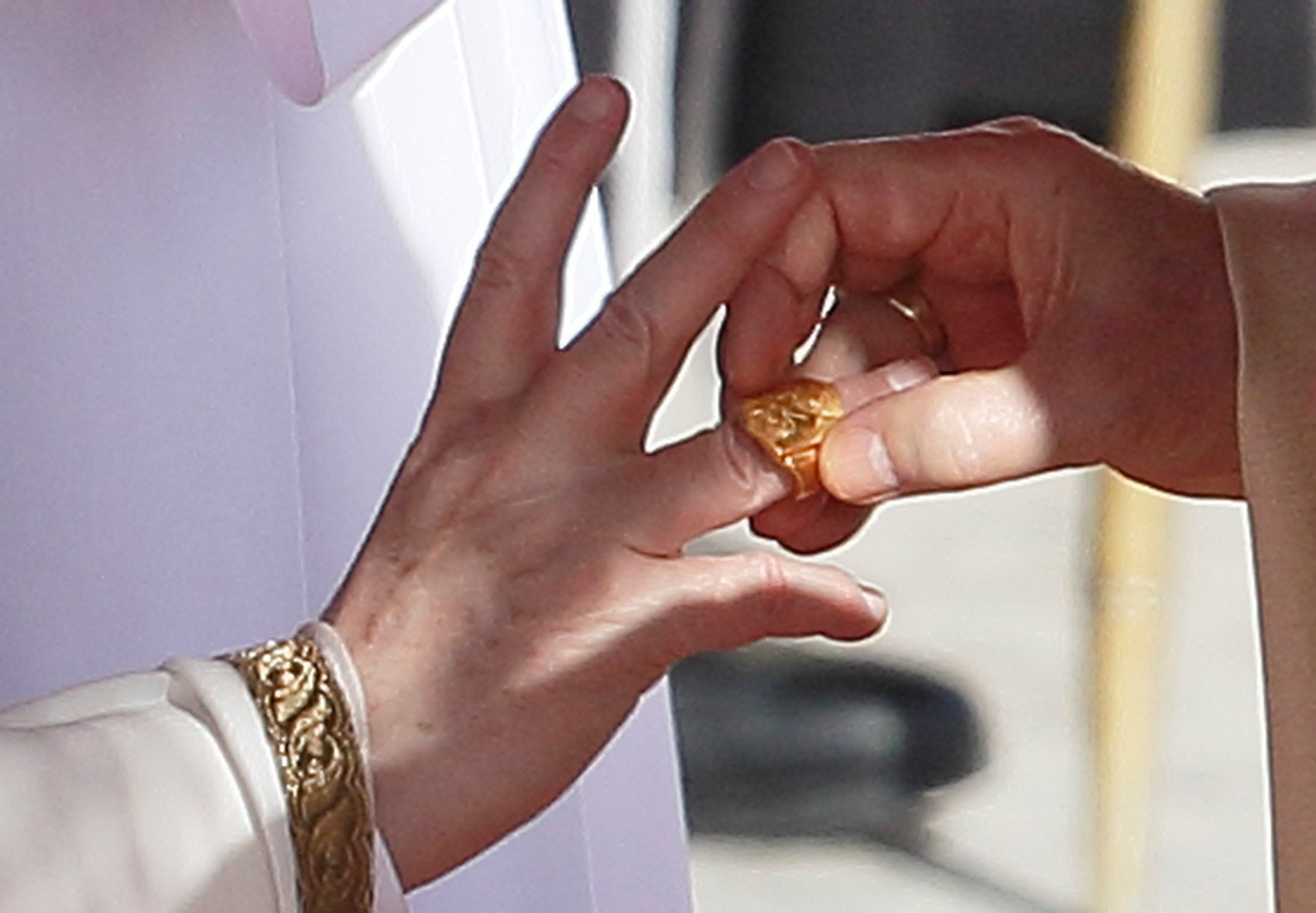 Pope Francis, left, receives his ring from Cardinal Angelo Sodano, dean of the College of Cardinals, during his inaugural Mass in St. Peter's Square.