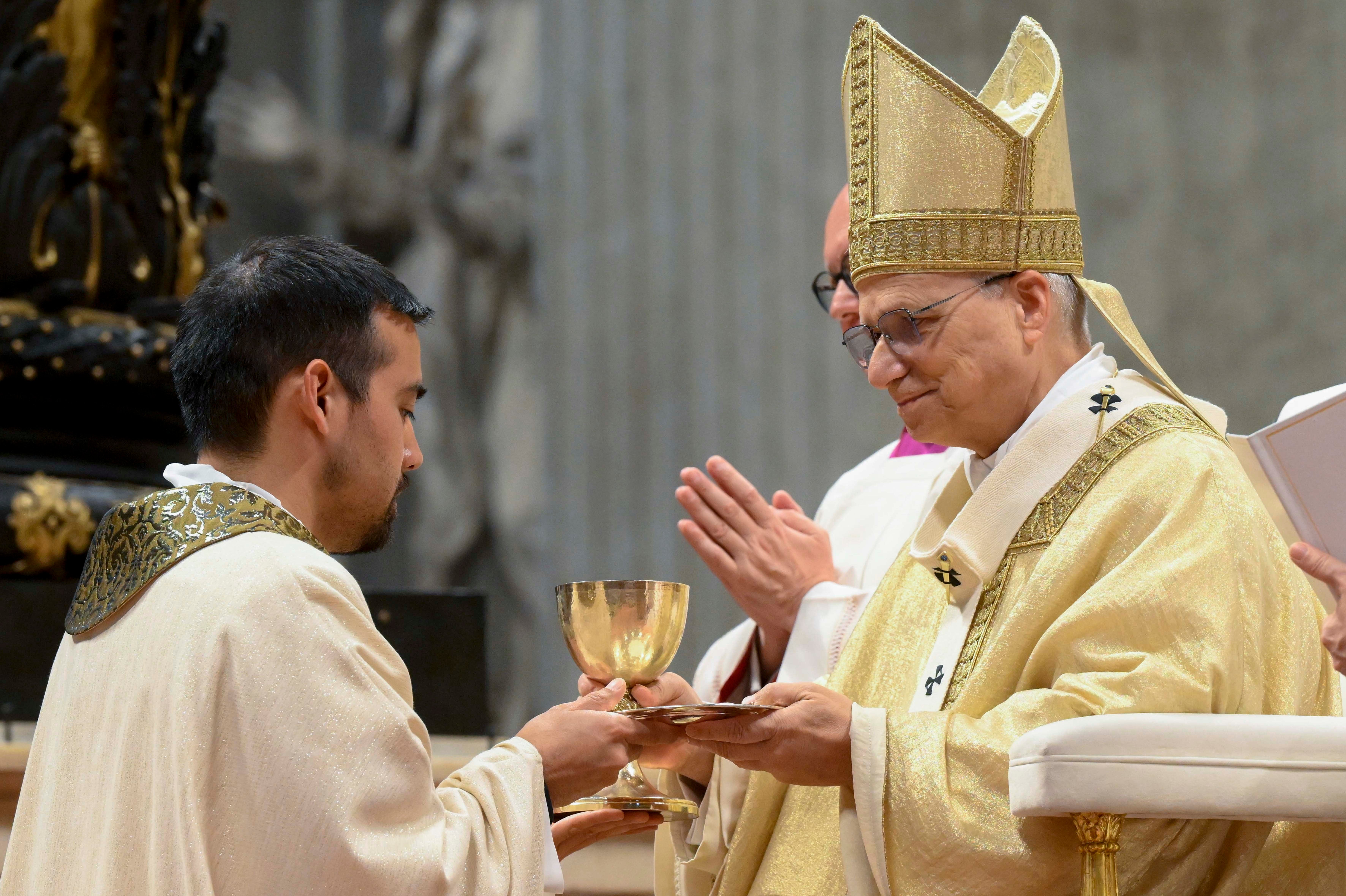Pope Leo XIV gives a chalice to a new priest