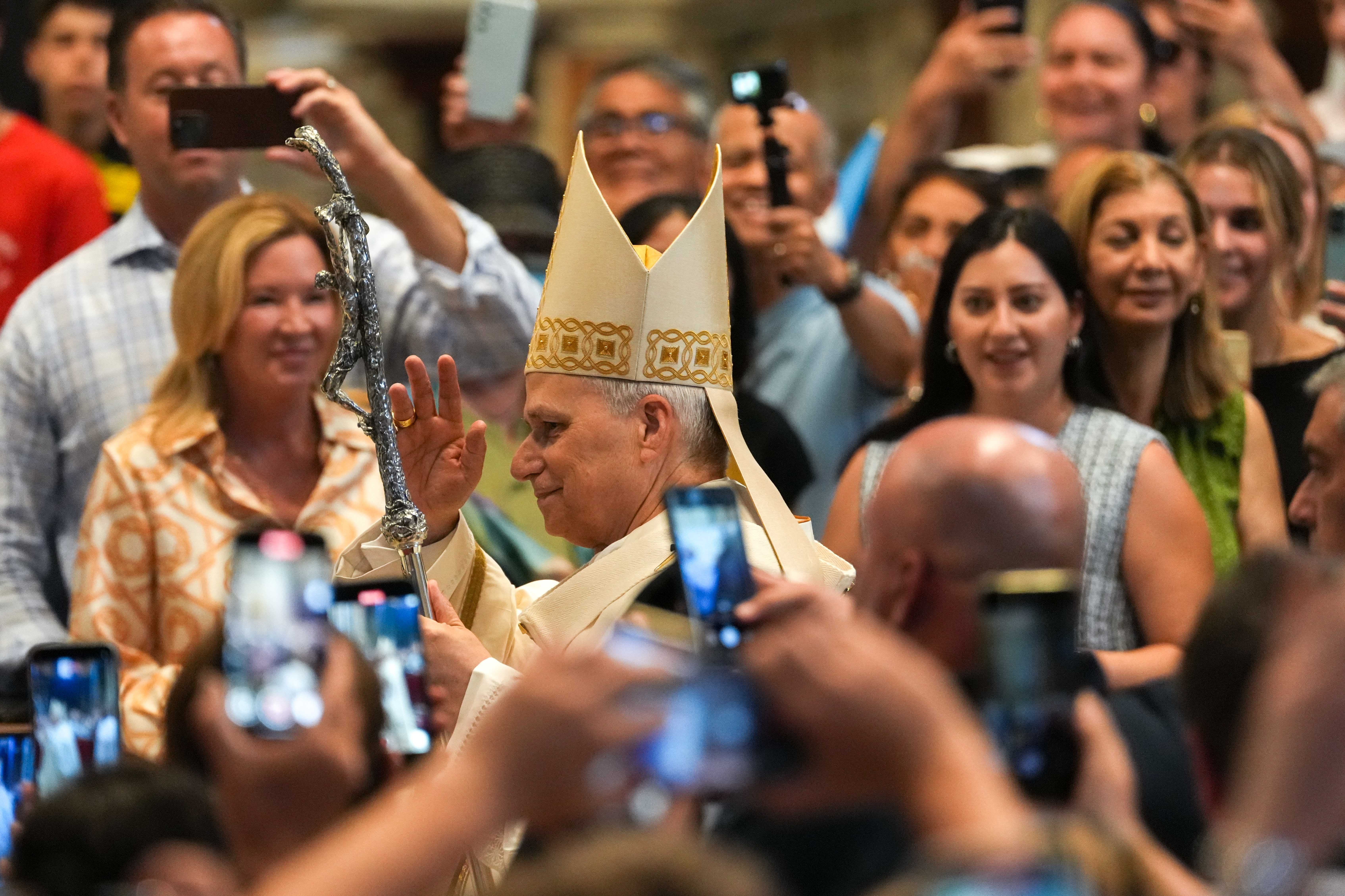 Pope Leo XIV processes into St. Peter's Basilica.