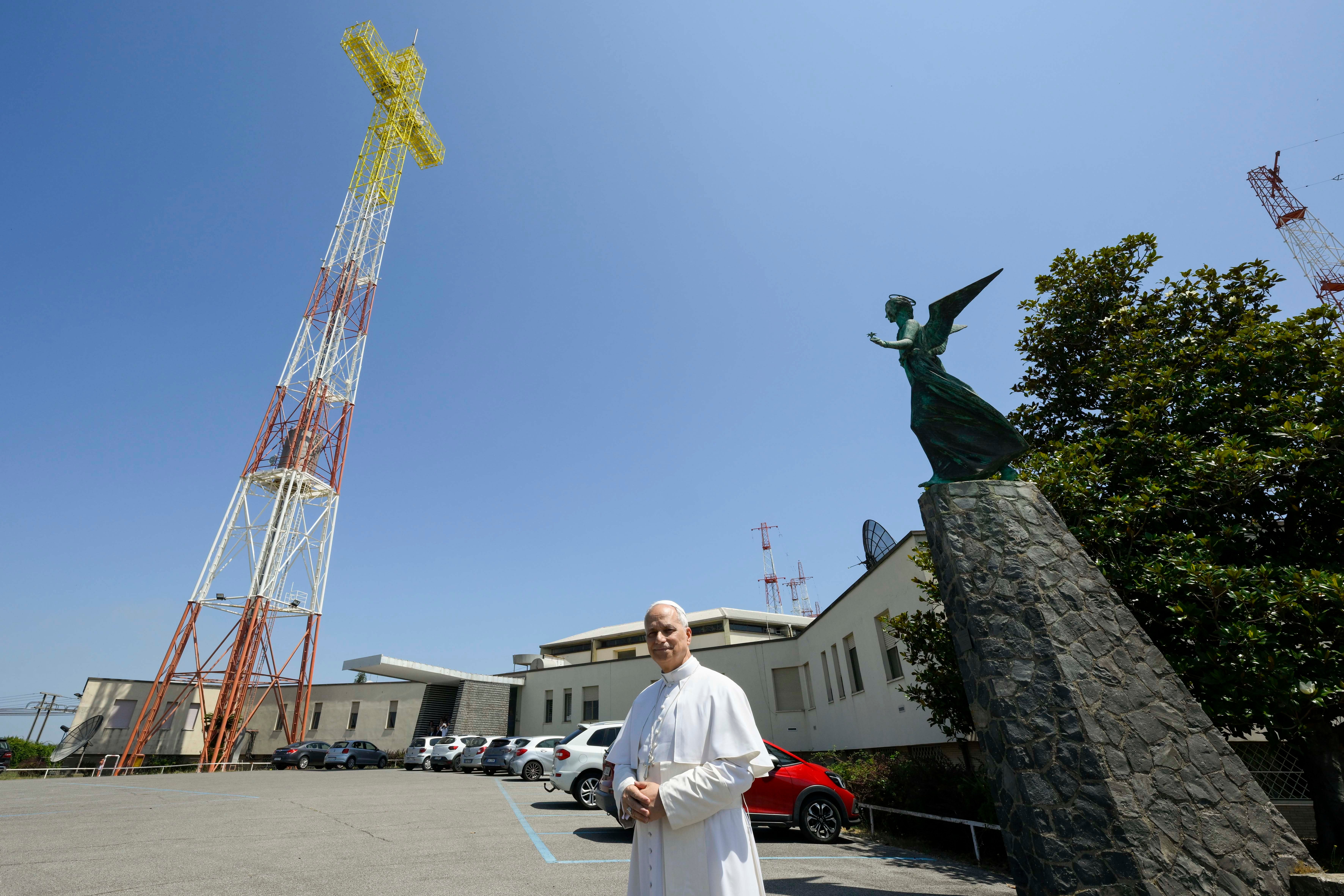 Pope Leo stands outside the Vatican Radio transmission center