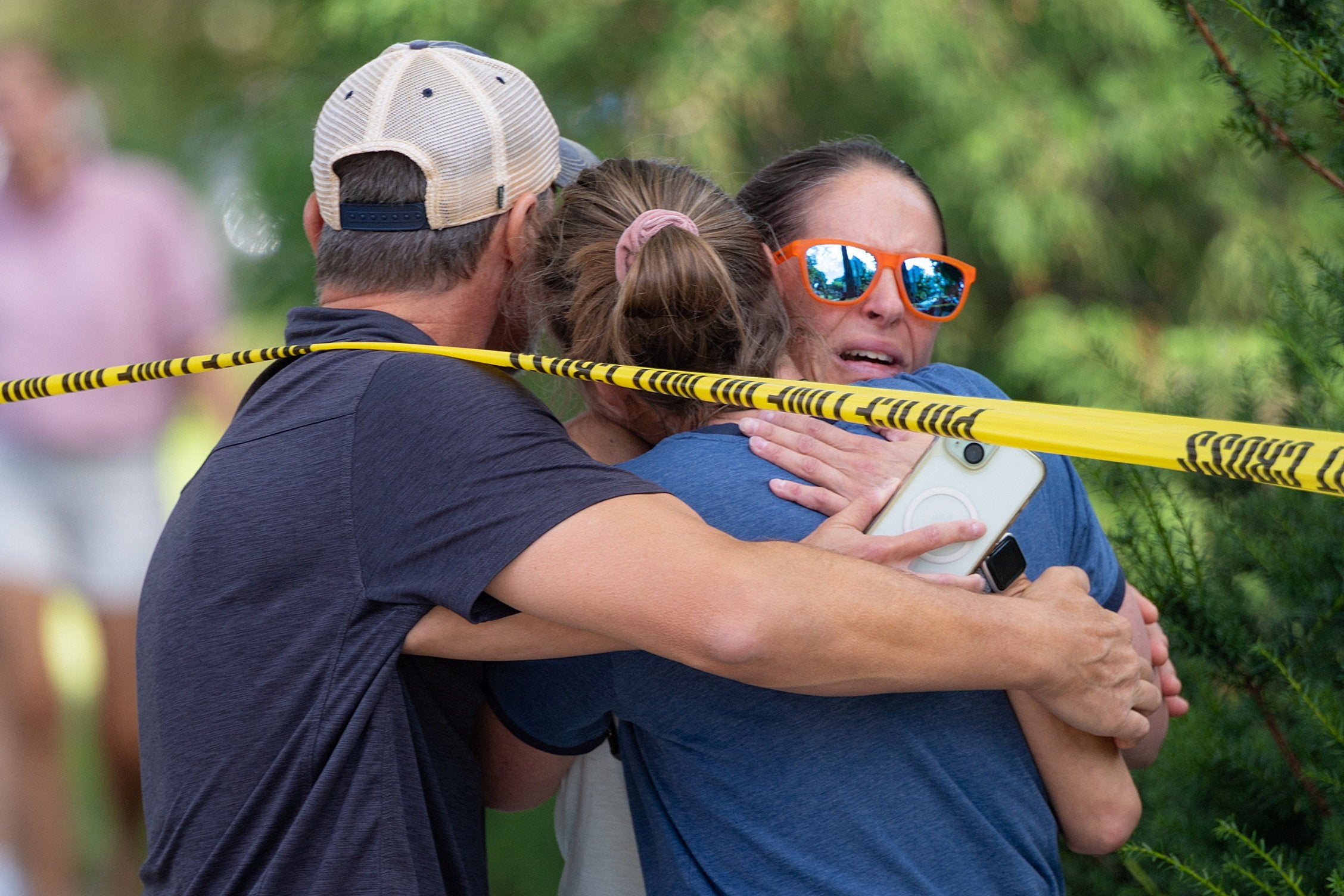 Families embrace after shooting at Minnesota church